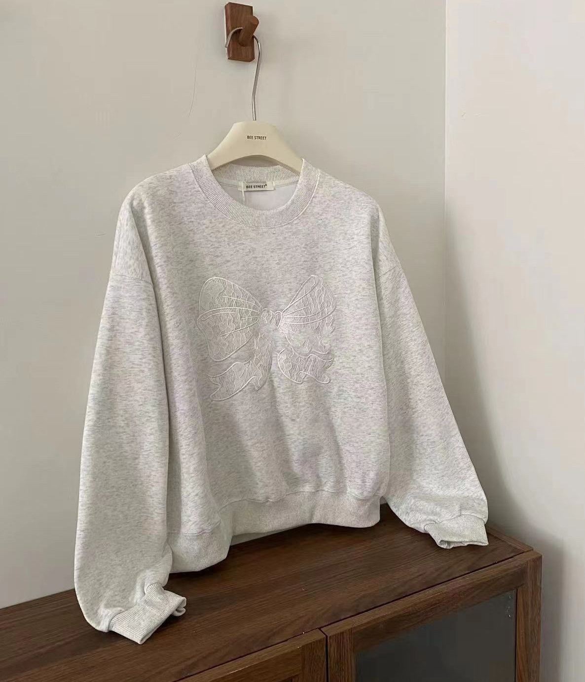 Korean-Style Relaxed Sweatshirt with Lace Bow Detail