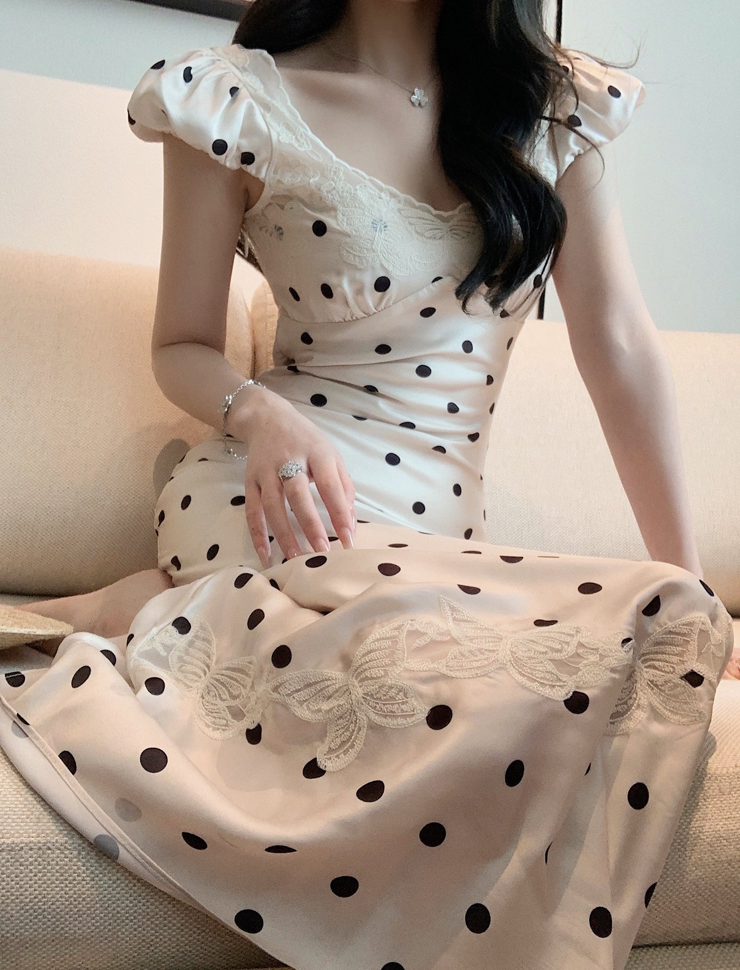 A black and white polka dot backless dress